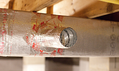 a metal pipe is attached to a wooden structure