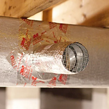 a close up of a pipe on a wooden structure